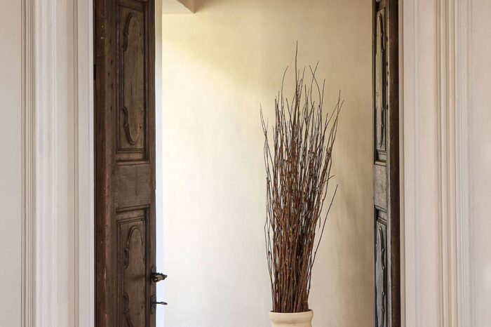 Luxury bedroom at Villa del Borgo with classic furnishings and natural light