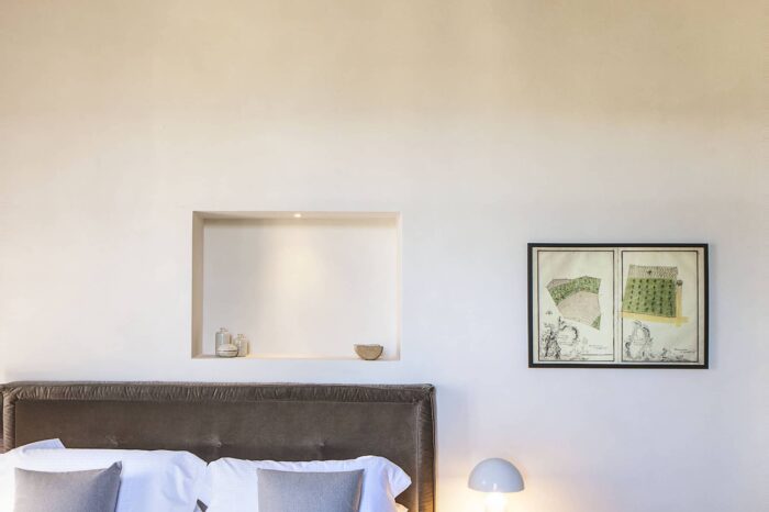 Luxury bedroom at Villa del Borgo with classic furnishings and natural light